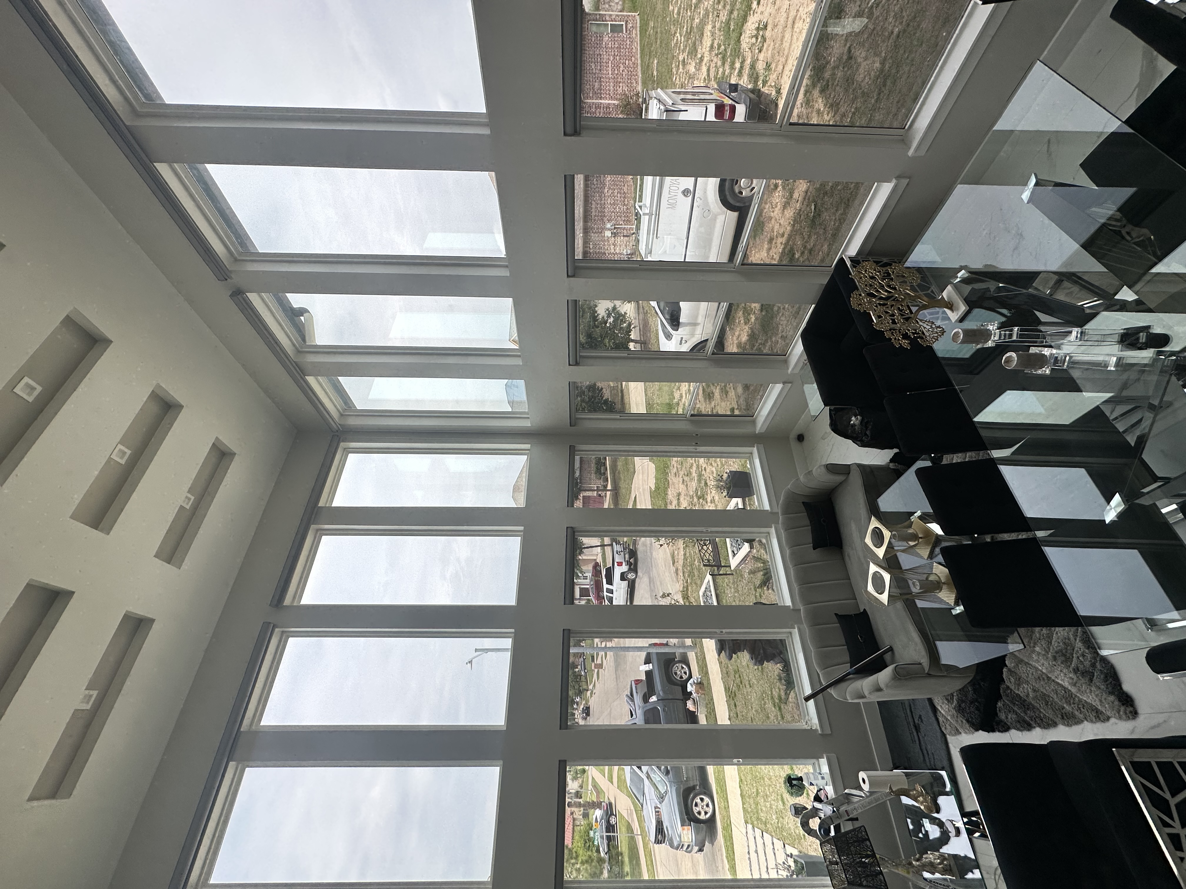Living room interior with floor-to-ceiling tinted windows