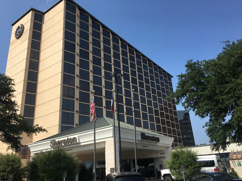 Sheraton Hotel exterior with full commercial window tinting